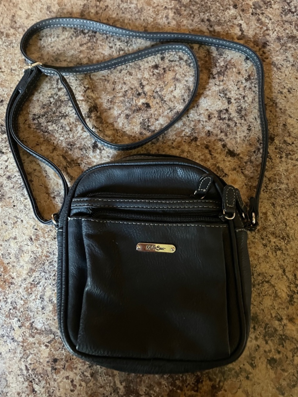 Black Crossbody Bag with Front Zip and Logo Plate